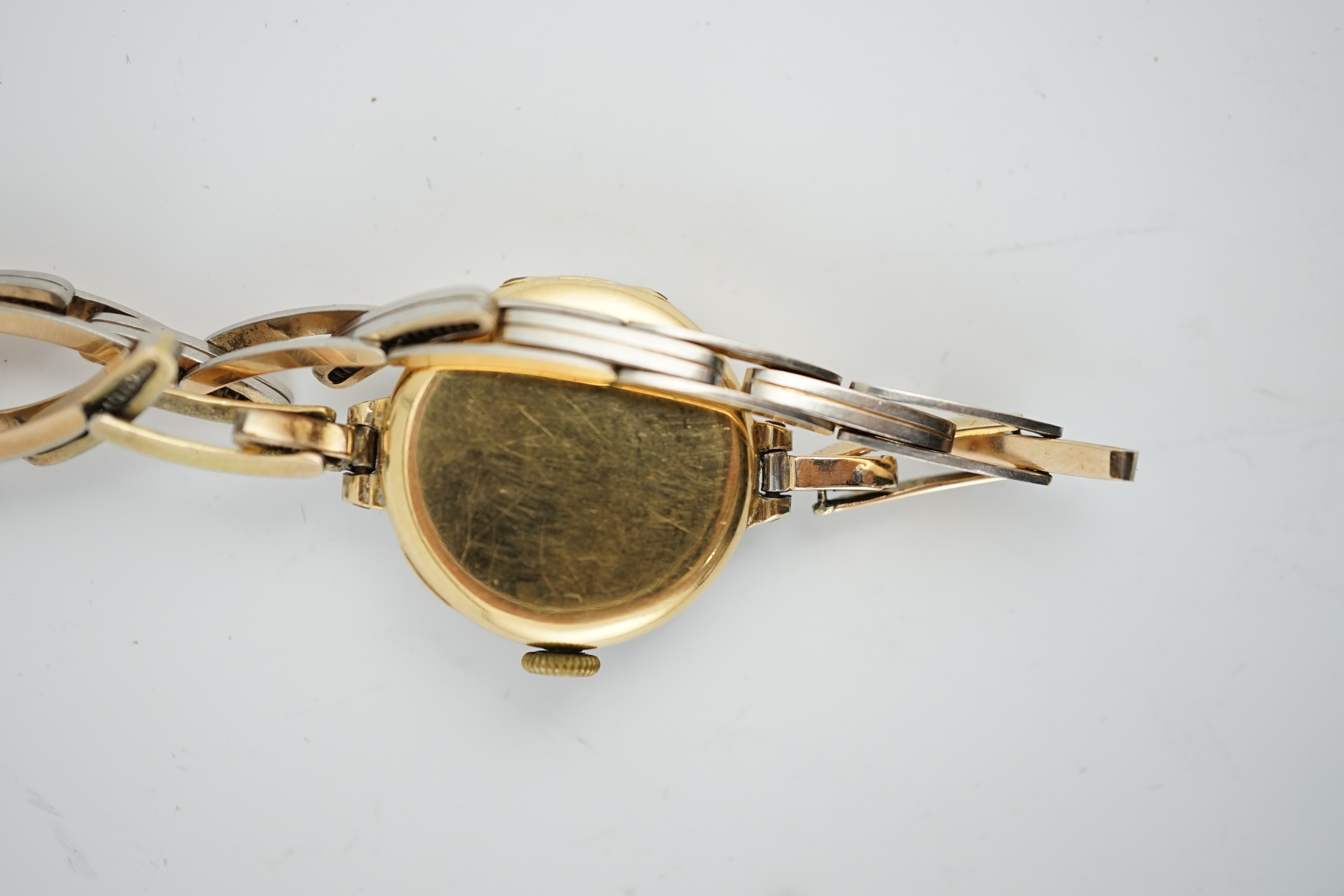 A lady's George V 18ct gold and platinum manual wind wrist watch